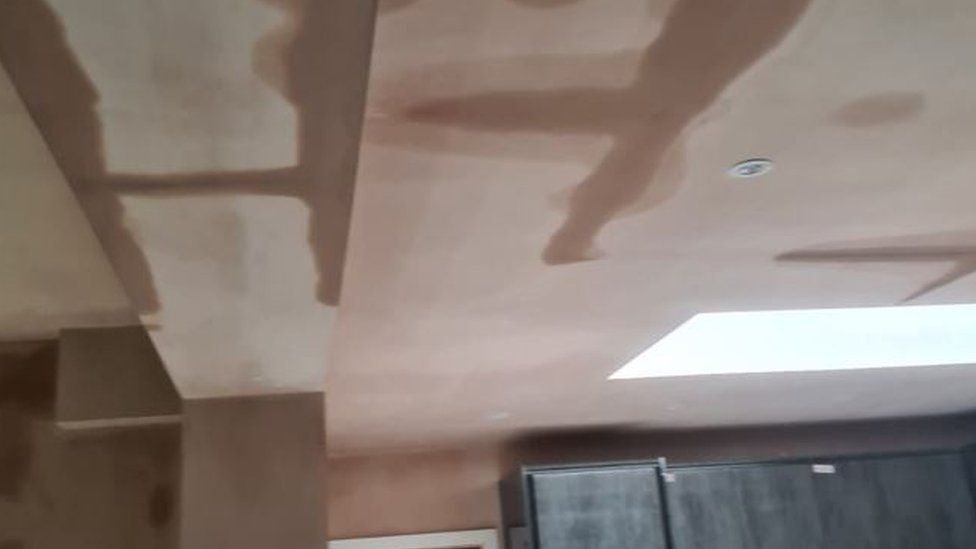 Water seeping through the roof at Sarah Griffiths' home in Bury