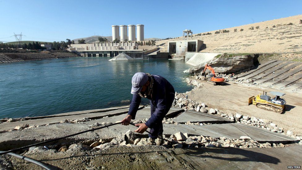 Employees work at strengthening Mosul Dam, northern Iraq, 3 February