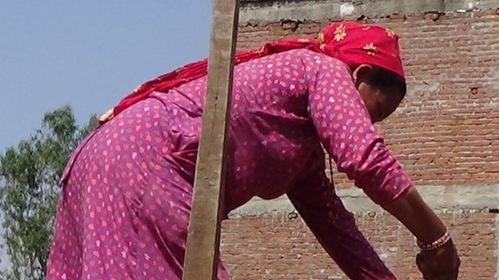 Sanumaya Kumal at building site in Bidur in Nuwakot district