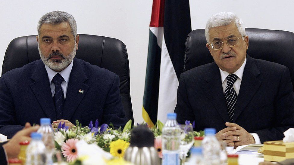 Then-Palestinian Prime Minister Ismail Haniyeh and Palestinian President Mahmoud Abbas chair the first meeting of the new Palestinian unity government on 18 March 2007 in Gaza City