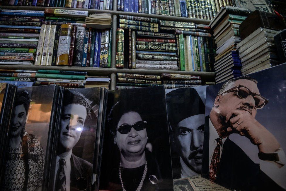 Posters of famous Egyptian singers, actors and politicians are seen on sale at Cairo's historic al-Azbakeya book market at downtown in Cairo on January 16, 2019.