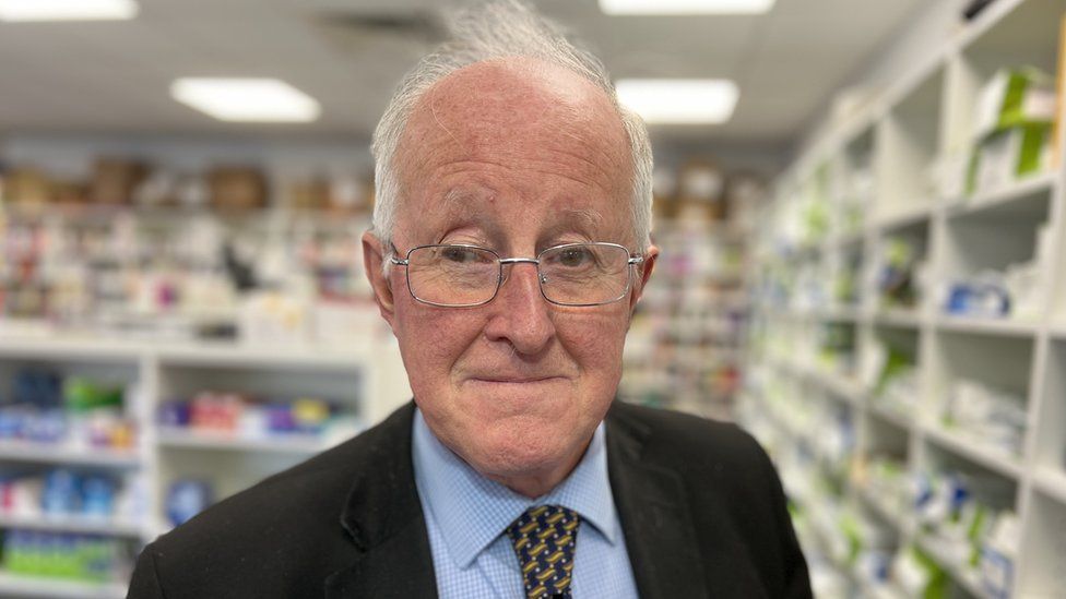 Peter Badham in his pharmacy