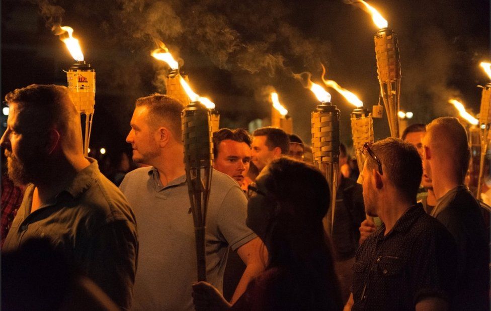 White nationalists carry torches on the grounds of the University of Virginia, on the eve of a planned Unite The Right rally in Charlottesville, Virginia, U.S. August 11, 2017.