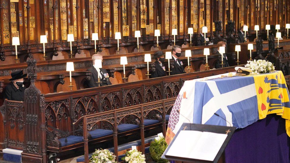 Queen Elizabeth II looks at the coffin of her husband the Duke of Edinburgh at St George's Chapel