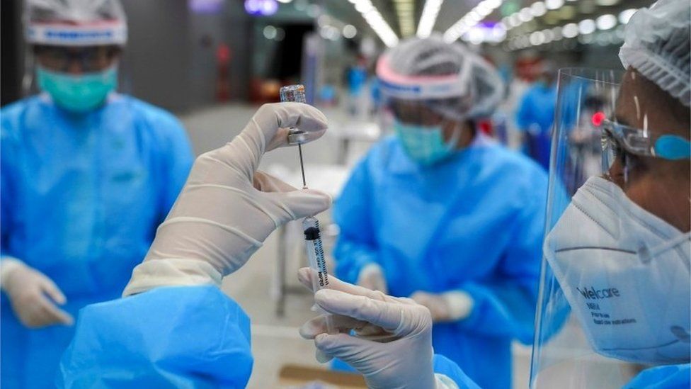 A medical worker prepares a syringe with a dose of China's Sinovac coronavirus disease (COVID-19) vaccine at the Central Vaccination Center, inside the Bang Sue Grand Station, in Bangkok, Thailand, 24 May 2021.