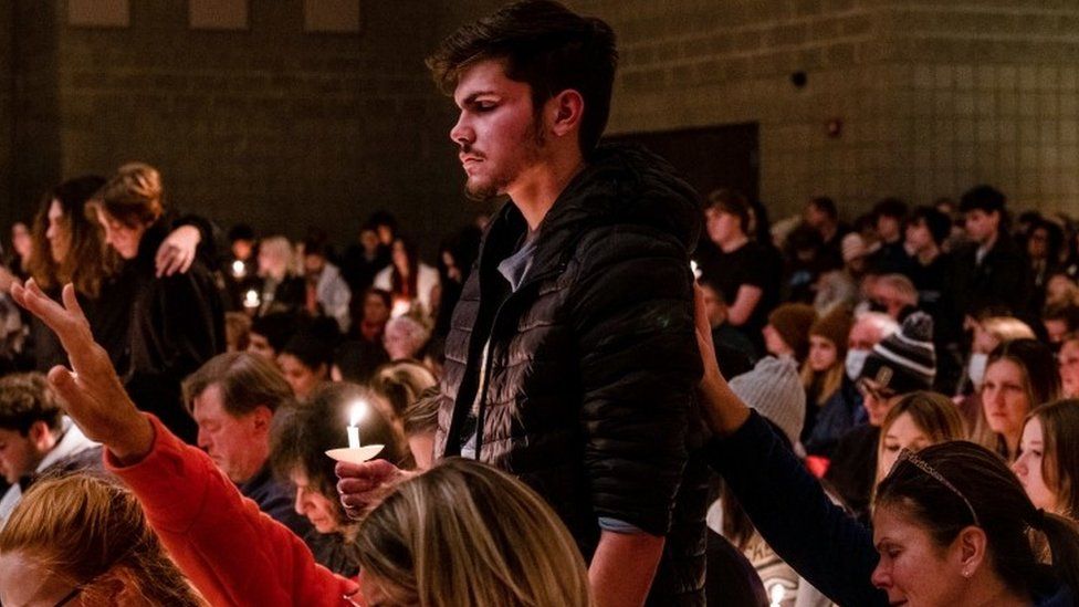 A student of Oxford High is prayed for during a prayer vigil at Lake Point Community Church in Oxford, Michigan