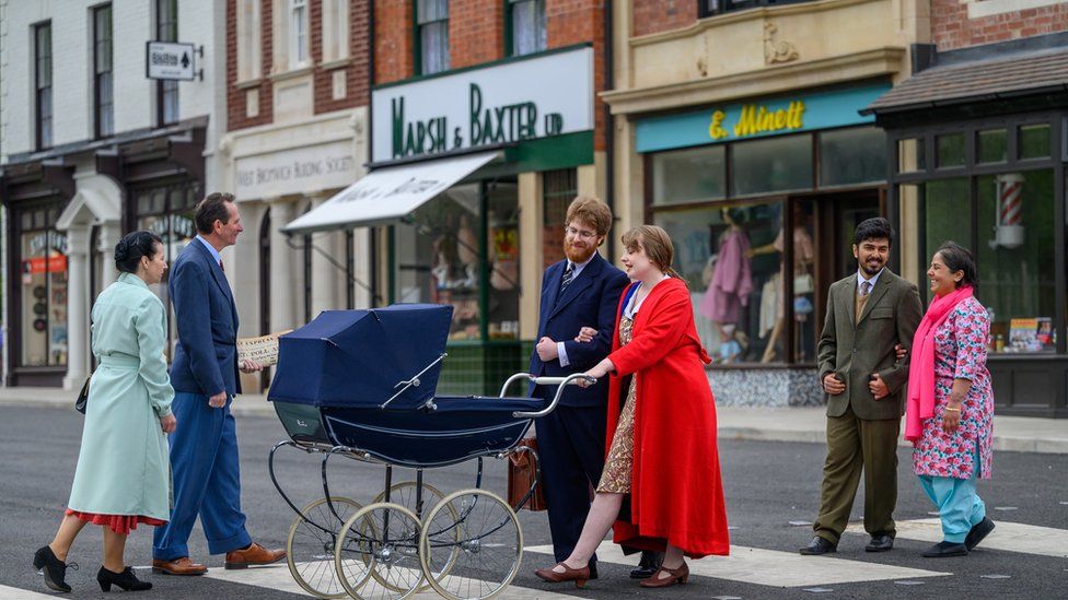 Actors on the 1960s high street at the Black Country Living Museum