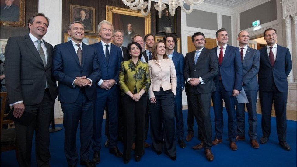 Dutch political party leaders including Party for Freedom (PVV) leader Geert Wilders (3-L) and Prime Minister Mark Rutte (7-L) pose for a group photograph with Speaker of the House of Representatives, Khadija Arib (5-L), as they attend a meeting of Dutch political party leaders at the House of Representatives to express their views on the formation of the cabinet, on 16 March 2017 in The Hague, Netherlands