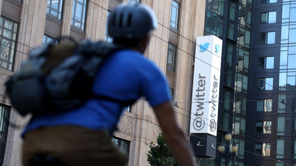A cyclist passes by the Twitter headquarters in San Francisco, California.