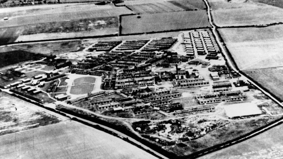 A black and white aerial shot of the hospital during World War Two, showing single-storey buildings in expansive countryside