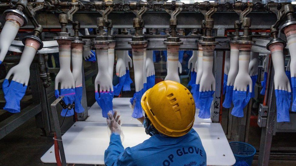 Worker in Top Glove factory