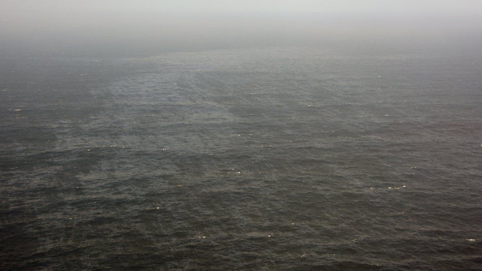 A handout picture of a section of oil slick in the Atlantic Ocean