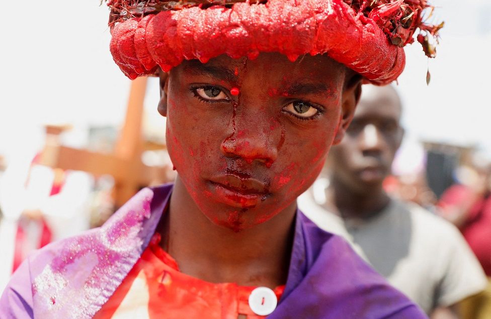 Kenyan Catholic devotee Joseph Browlins portrays Jesus Christ during a re-enactment of the crucifixion.