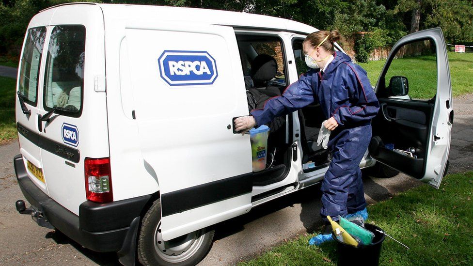 an RSPCA Officer with her van