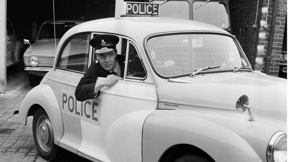 A police officer seated in a Morris Minor patrol car, April 1971. (Photo by Chris Ware/Keystone Features/Hulto