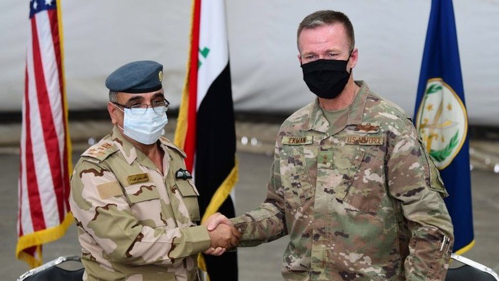 Gen Salah Abdullah (L) shakes hands with Gen Kenneth Ekman, the deputy commander of Combined Joint Task Force-Operation Inherent Resolve, during a handover ceremony at Taji airbase, Iraq (23 August 2020)