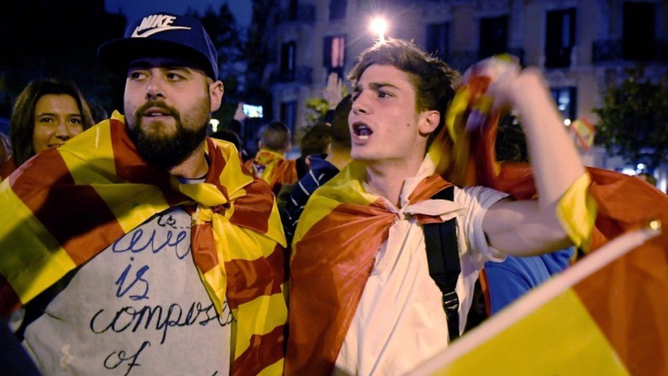 Protesters with Spanish flags shout slogans in favour of Spanish Constitution during a demonstration defending a united Spain on 4 October 2017 in Barcelona