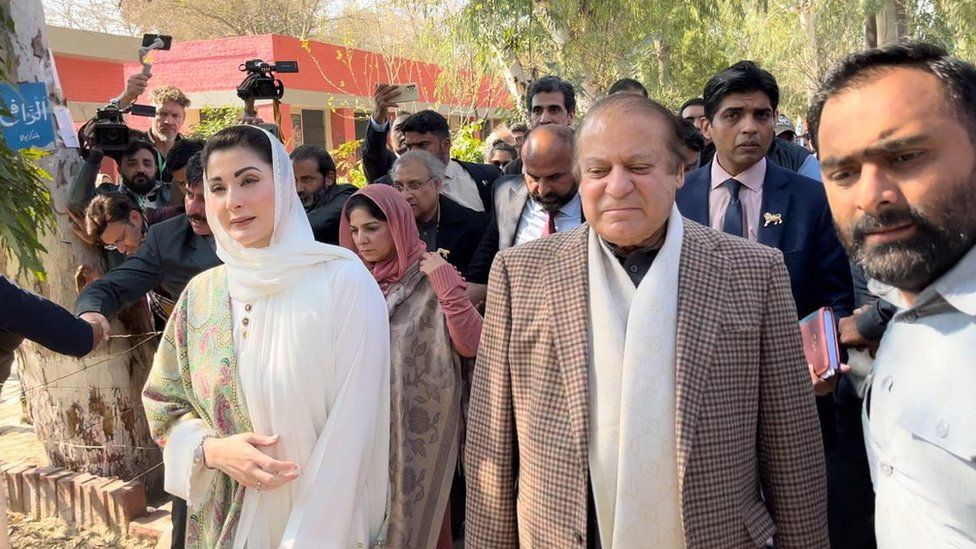 Nawaz Sharif (right) seen with his daughter Maryam Nawaz at a polling station in Lahore