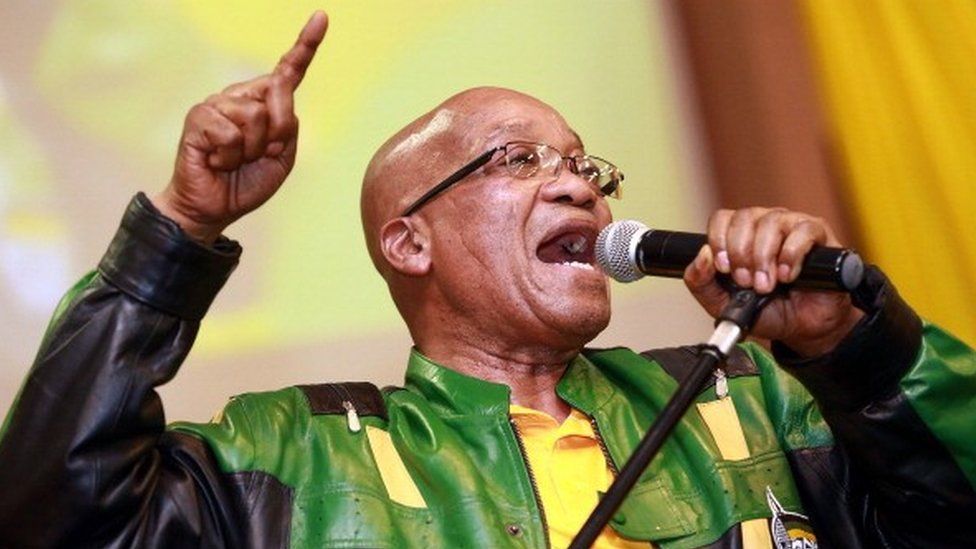 South African President and African National Congress (ANC) President Jacob Zuma leads hundreds of supporters in singing a song during a campaign event at the Inter-fellowship Church in Wentworth township, outside of Durban, on April 9, 2014