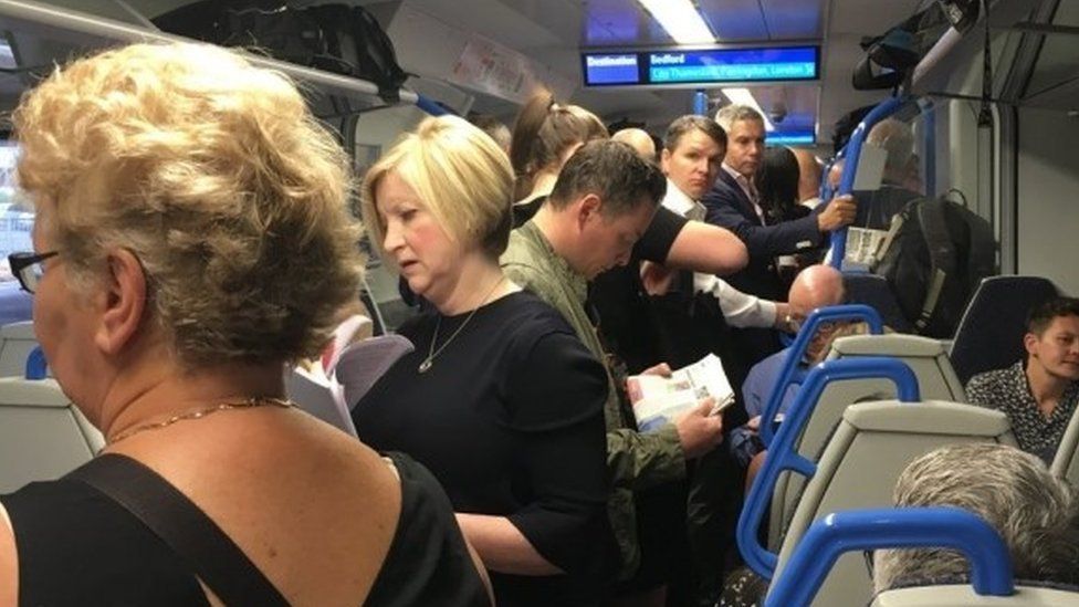 Passengers on crowded train