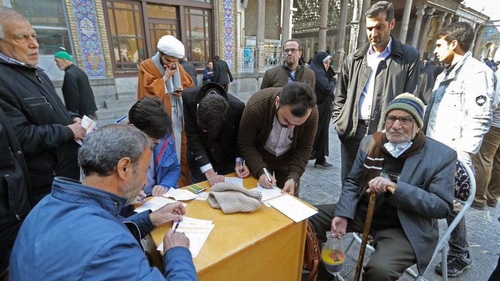 Residents of Tehran casts their votes in Friday's election