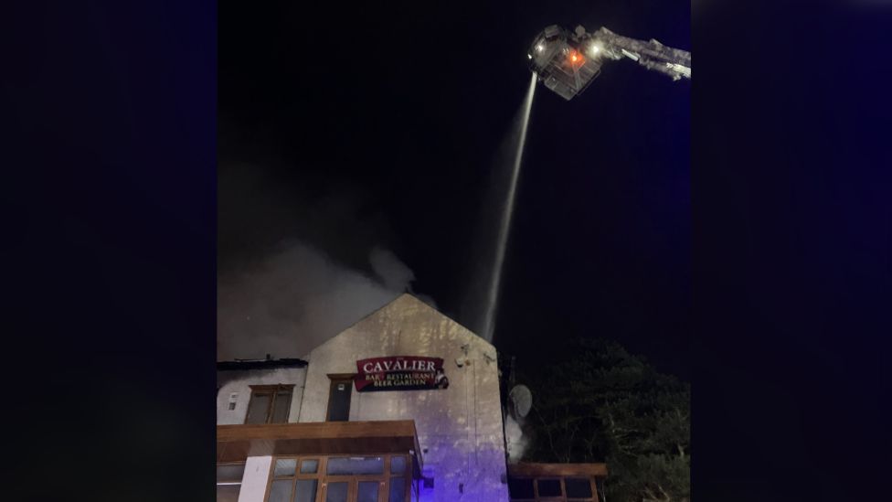 Aerial appliances tackling blaze at the Cavalier pub