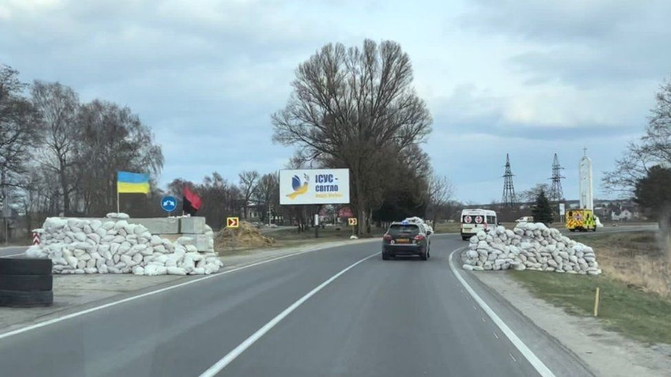 Ambulance convoy on a road just outside Lviv in Ukraine