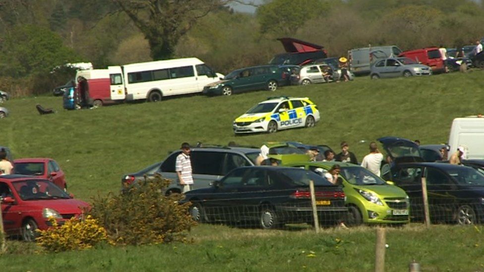 A police car at the site of the rave near Corfe Castle