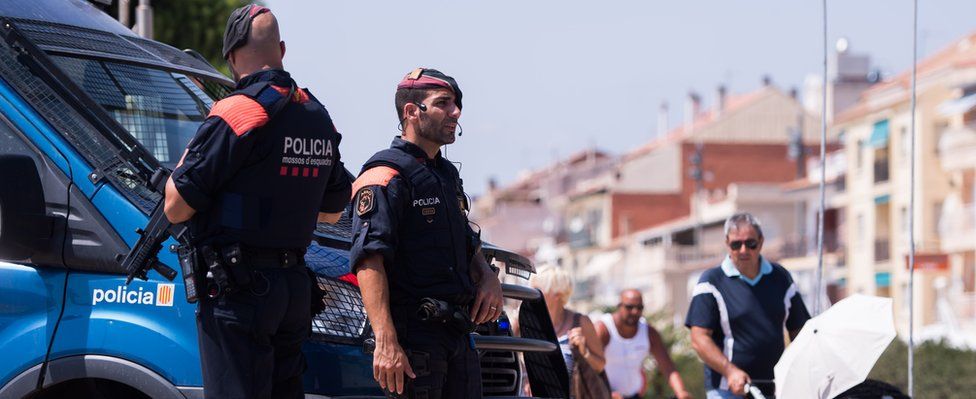 Police officers patrol on the spot where five terrorists were shot by police on August 18, 2017 in Cambrils, Spain.