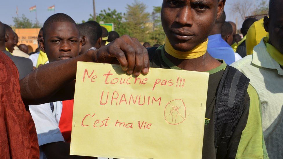 A Niger man holds a placard reading 'Don't touch!!! Uranium is my life' during a demonstration against French nuclear giant Areva.