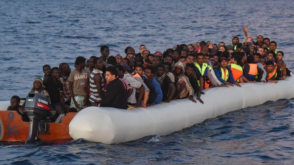 Migrants aboard rubber dinghy off Libya. File photo