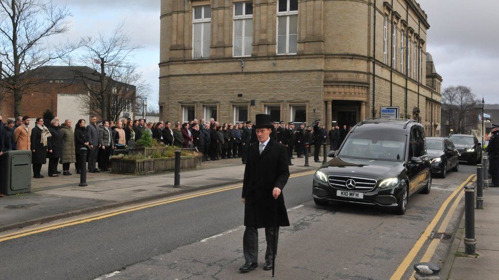 A guard of honour ahead of Peter Lawson's funeral