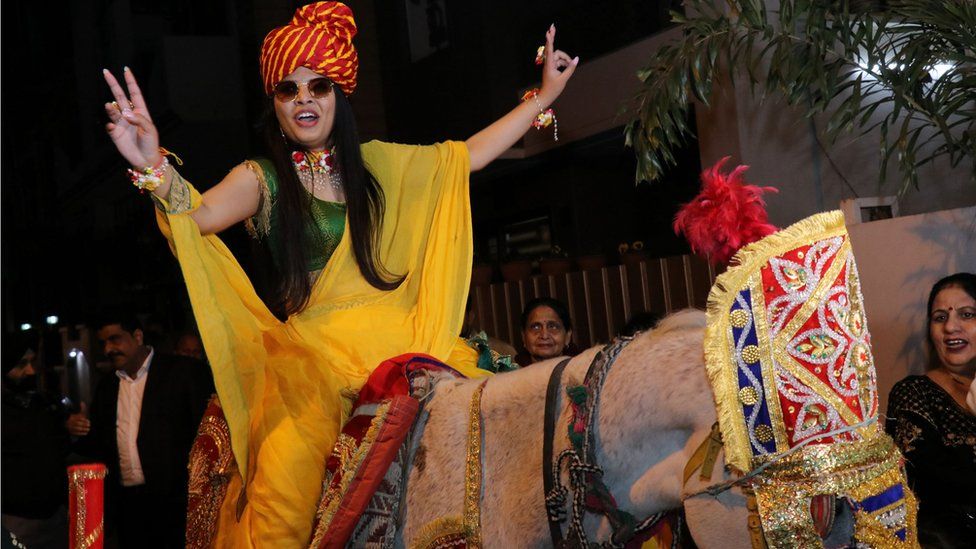 Priya Aggarwal arrives for her wedding on a white horse