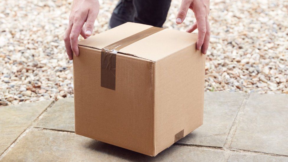 Stock image of a box being delivered