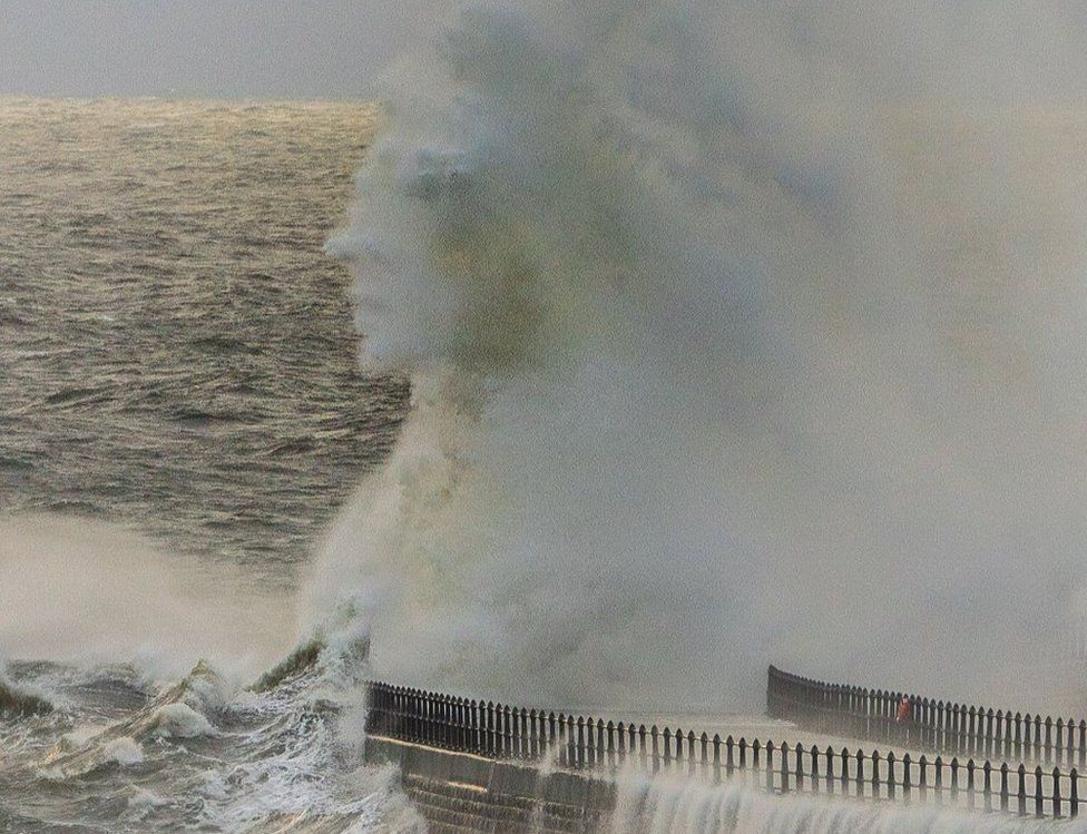 A face appears in a wave