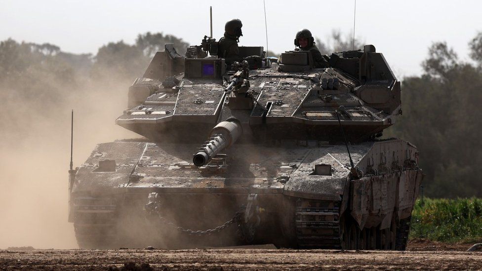 Israeli Merkava tank patrols the southern part of the Israel-Gaza perimeter fence near Khan Younis (23 January 2024)