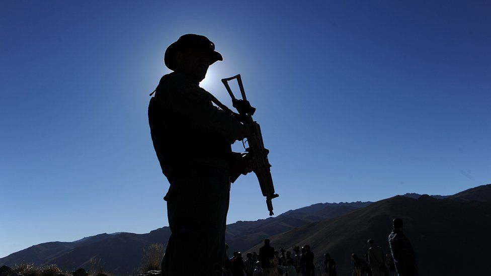 A security guard keeps watch at Kotal-e-Kherskhan in Wardak province on September 25, 2010.