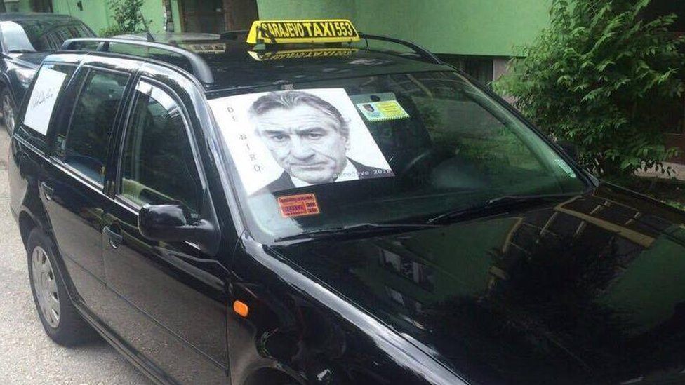 A Sarajevo taxi displays a picture of Robert De Niro