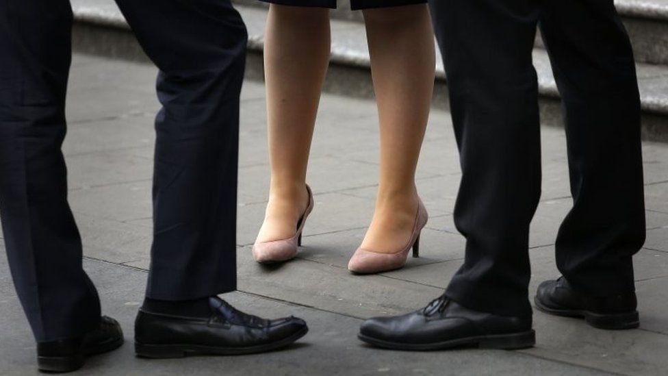 The legs of workers in the City of London on 8 April 2015