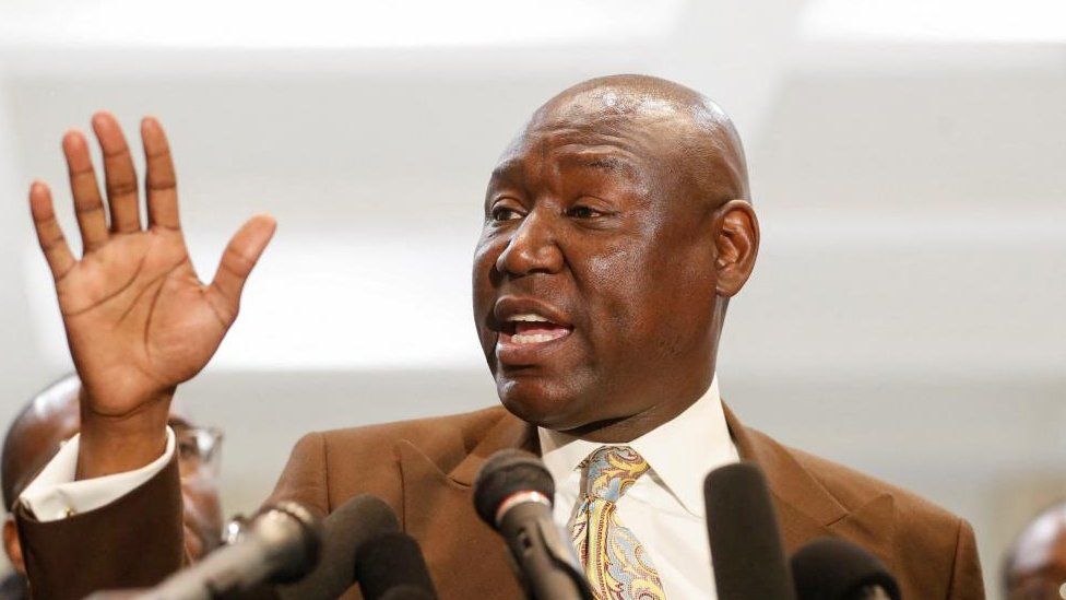 Lawyer Ben Crump stands at a lectern