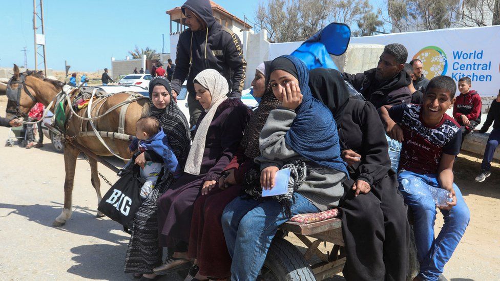 Palestinians fleeing north Gaza after Israeli troops raided al-Shia hospital, move southward, amid the ongoing conflict between Israel and Hamas, in the central Gaza Strip March 21, 2024