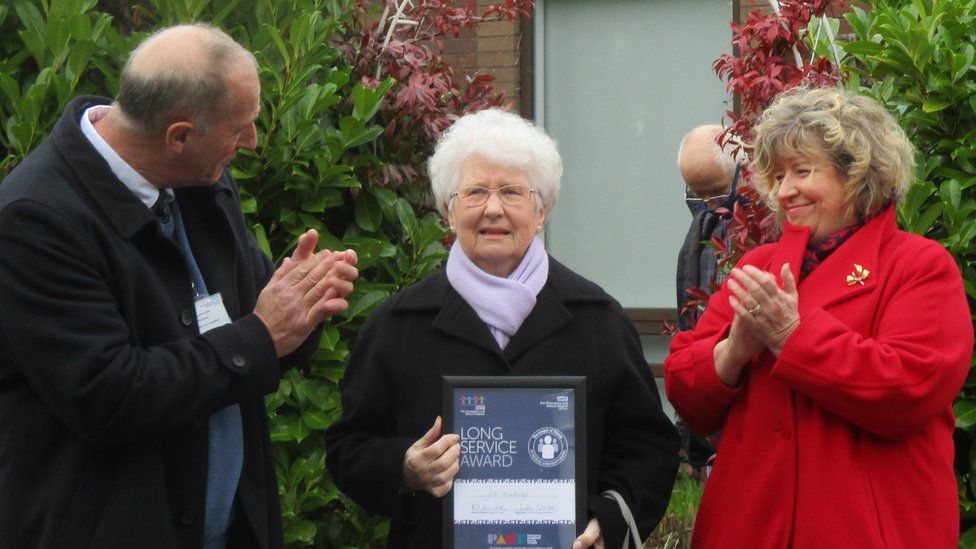 Jill Wellings receiving an award from the League of Friends Executive Chairman Richard Steventon and Julia Clarke, a Trust Director of Shrewsbury & Telford Hospital Trust.