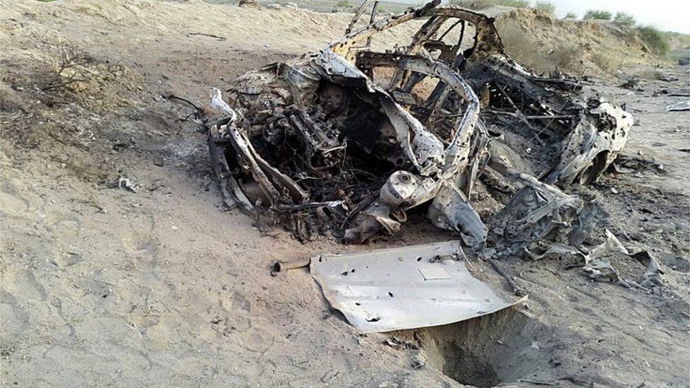 This photo taken by a freelance photographer Abdul Salam Khan using his smart phone on Sunday, May 22, 2016, purports to show the destroyed vehicle in which Mullah Mohammad Akhtar Mansour was traveling in the Ahmad Wal area in Baluchistan province of Pakistan, near Afghanistan"s border.