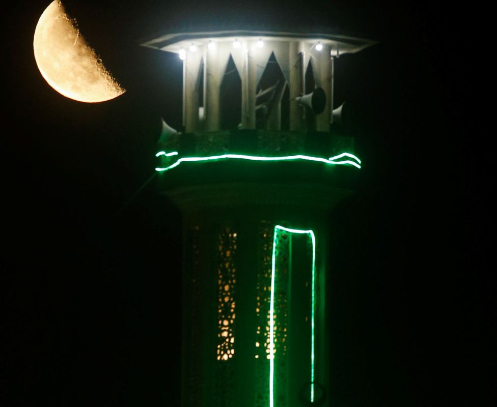 A moon seen behind a minaret at night in Cairo, Egypt - Tuesday 4 May 2021