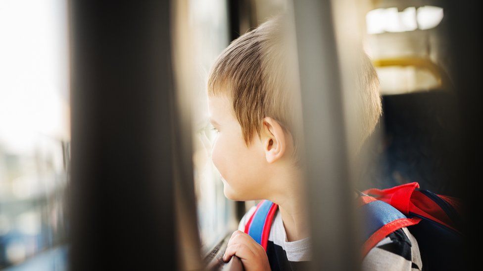 Stock image of a child on a bus