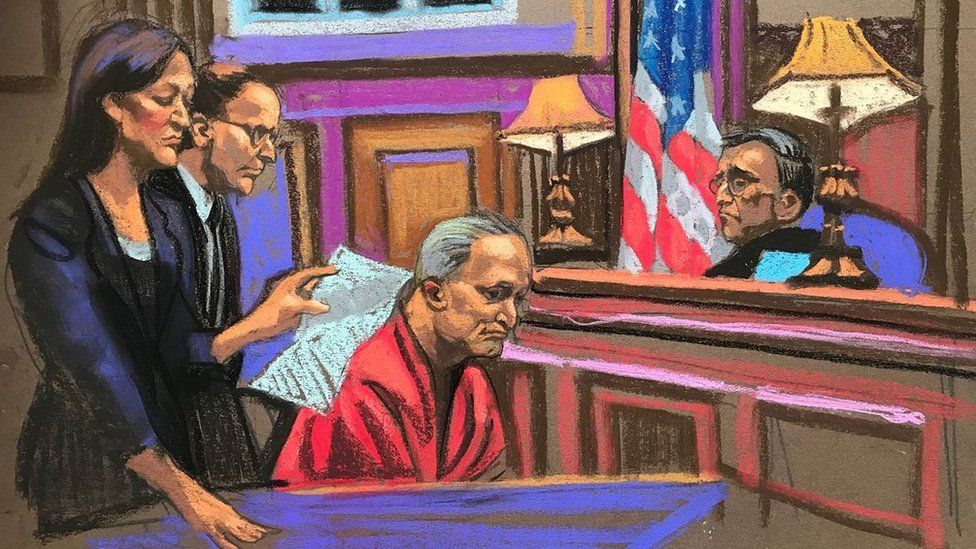 A drawing of Robert Bowers in court looking down while a lawyer addresses the judge