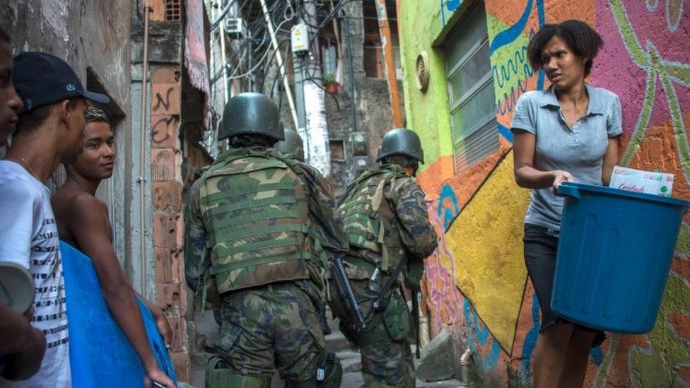 Members of the police and the armed forces take part in an operation to fight heavily-armed drug traffickers at the Rocinha favela in Rio de Janeiro, Brazil, on September 22, 2017