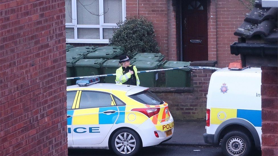Forensic technicians work outside a home in Matlock Road, Reddish
