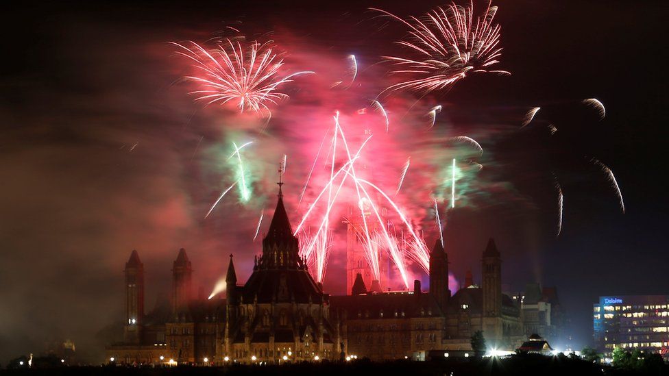 Fireworks explode over Ottawa's Parliament Hill as part of Canada Day celebrations in Gatineau, 2 July 2017