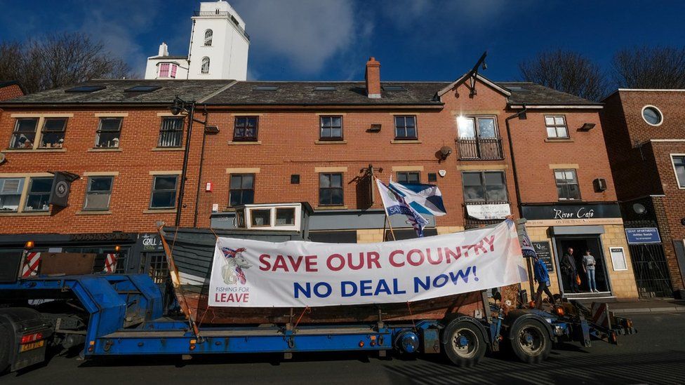 Fishing For Leave banner on a trawler on the back of a lorry